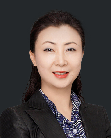 Professional woman in a suit, smiling, portrayed in a formal legal setting.