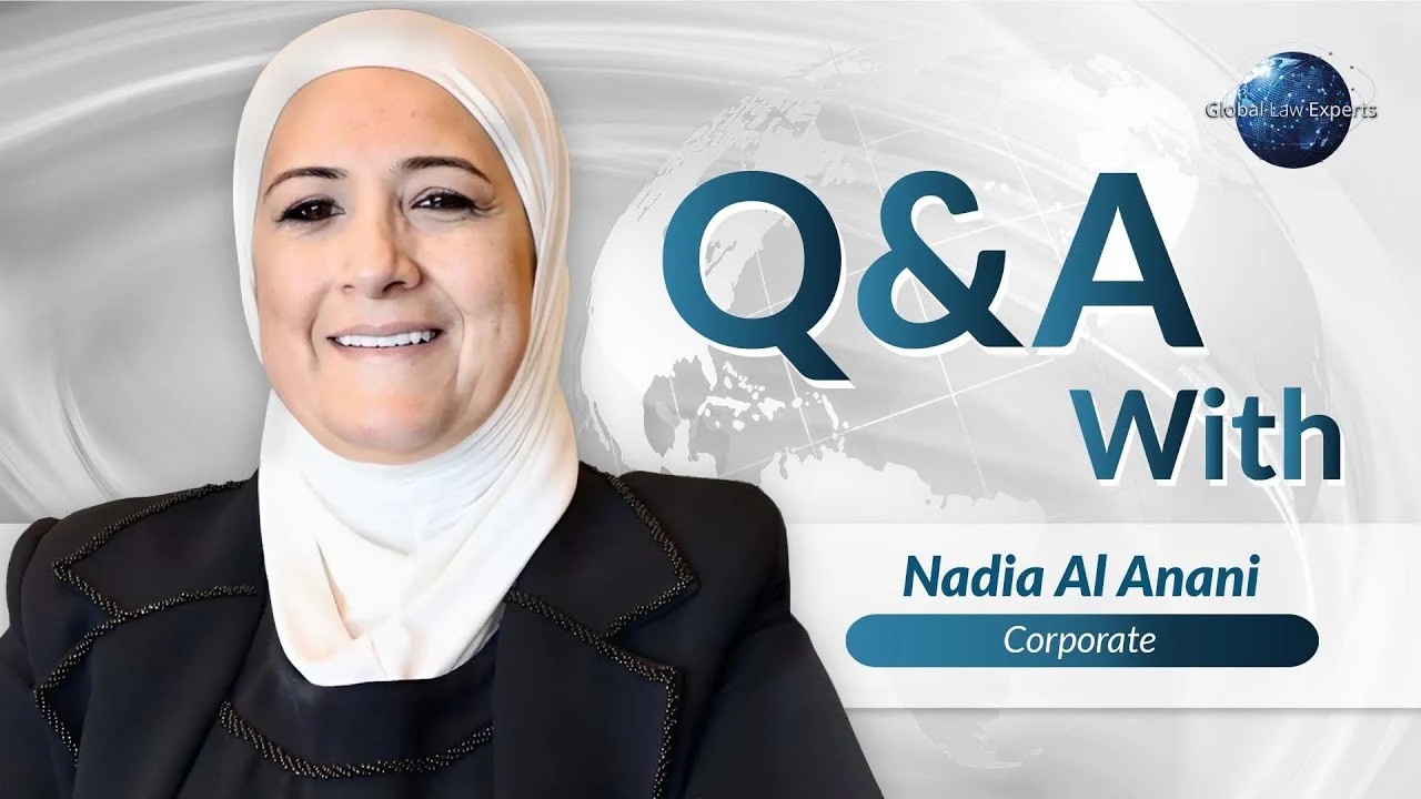 Corporate lawyer participating in a Q&A session, showcasing expertise against a global backdrop.