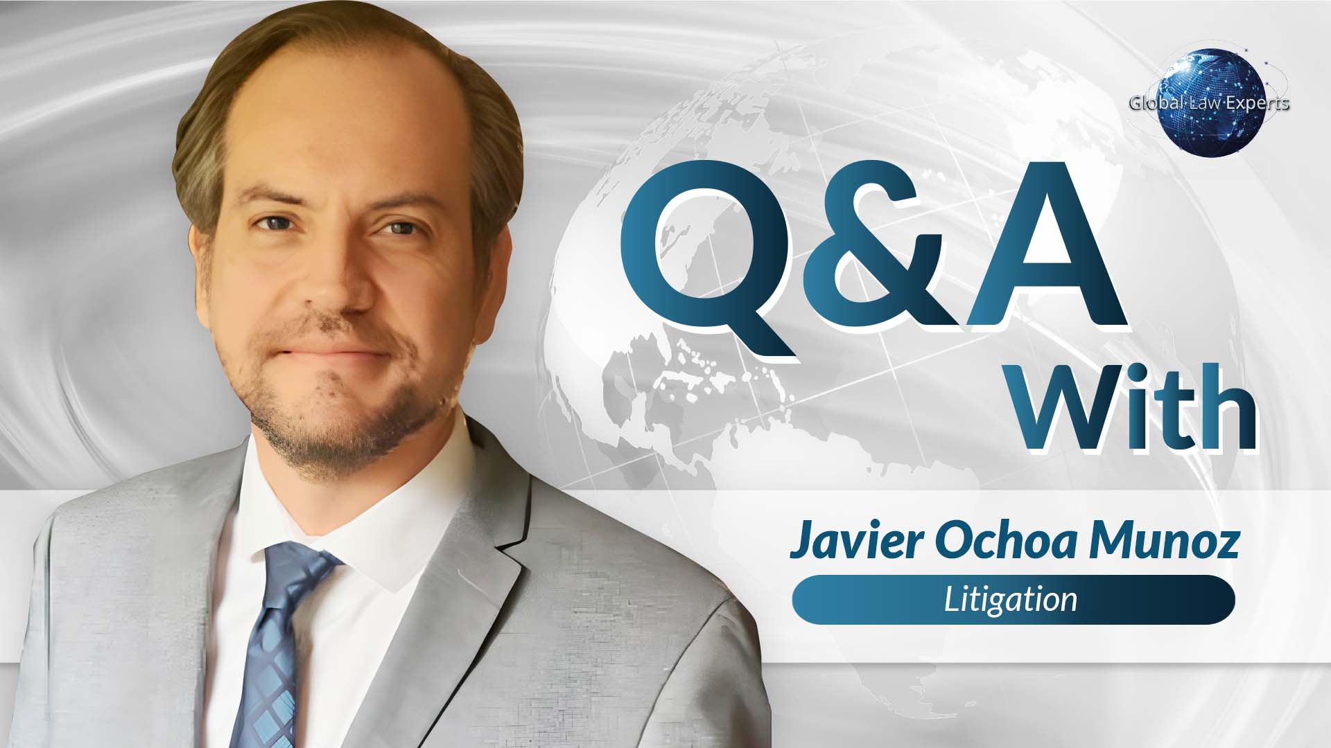 Litigation attorney Javier Ochoa Munoz in formal attire posing for a professional Q&A feature.
