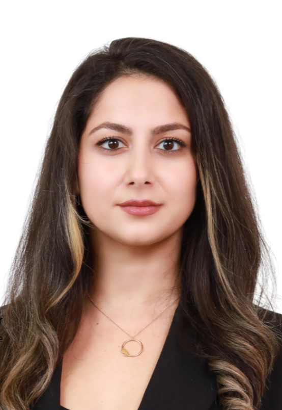 Professional lawyer with long hair, wearing a blazer, against a plain white background.