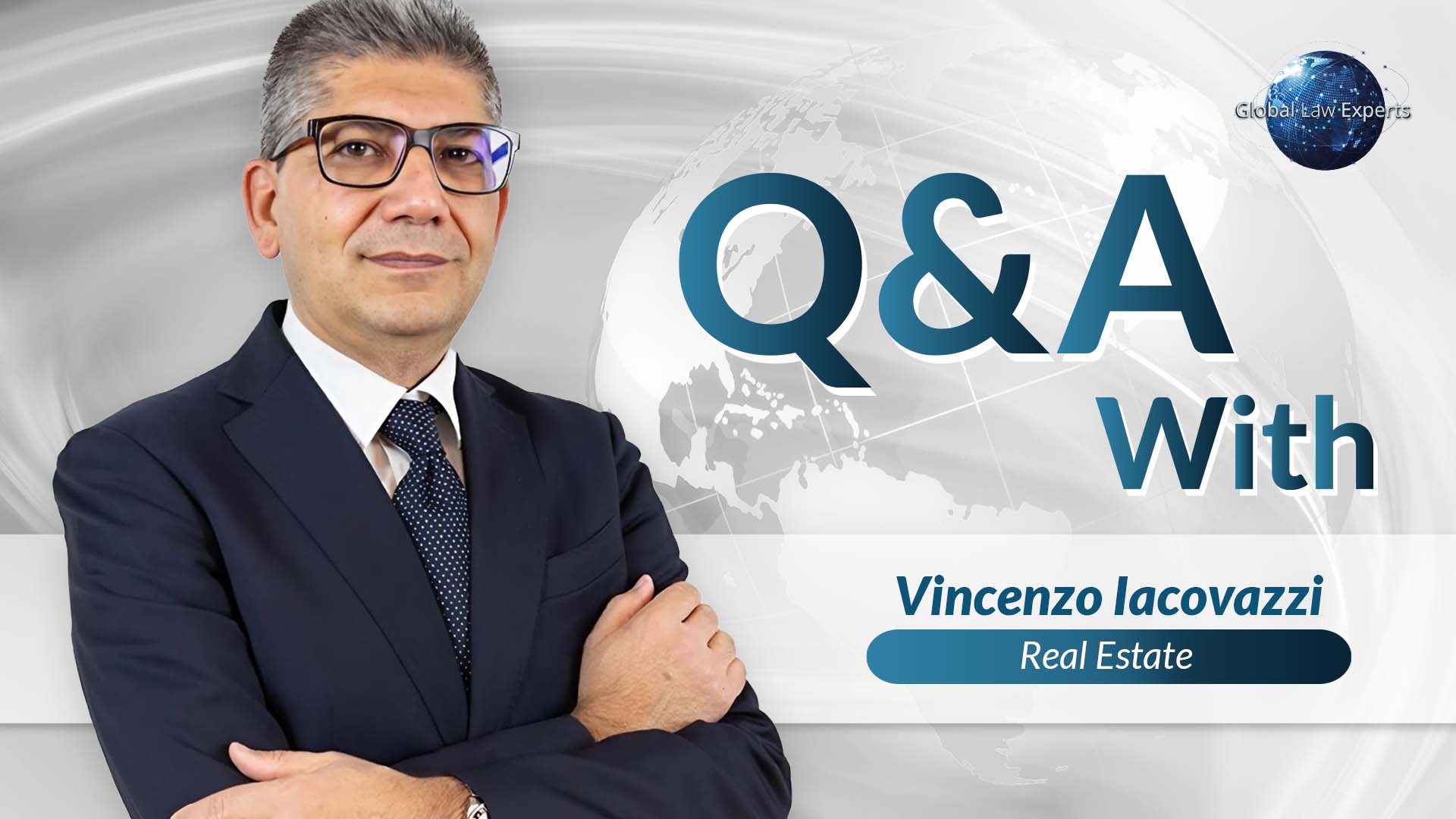Real estate lawyer Vincenzo Iacovazzi posing for a Q&A session with a blurred world map background.