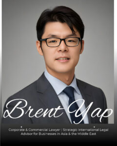 Lawyer in a suit with glasses, smiling, against a neutral background, suitable for professional profile use.