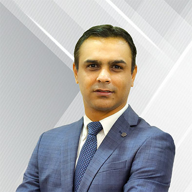 Lawyer in a blue suit posing confidently against a neutral background with an abstract design.