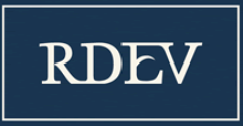 Blue logo featuring the letters "RDEV" in white uppercase font within a rectangular frame.