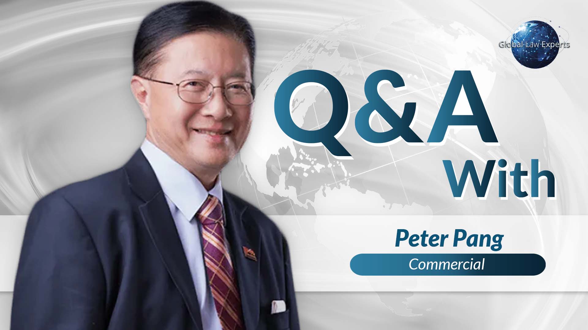 Lawyer participating in Q&A session, smiling against a backdrop of a global map and legal branding elements.