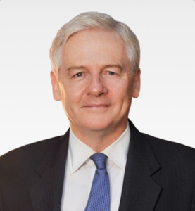Professional man in a suit with a neutral expression, suitable for a legal setting.