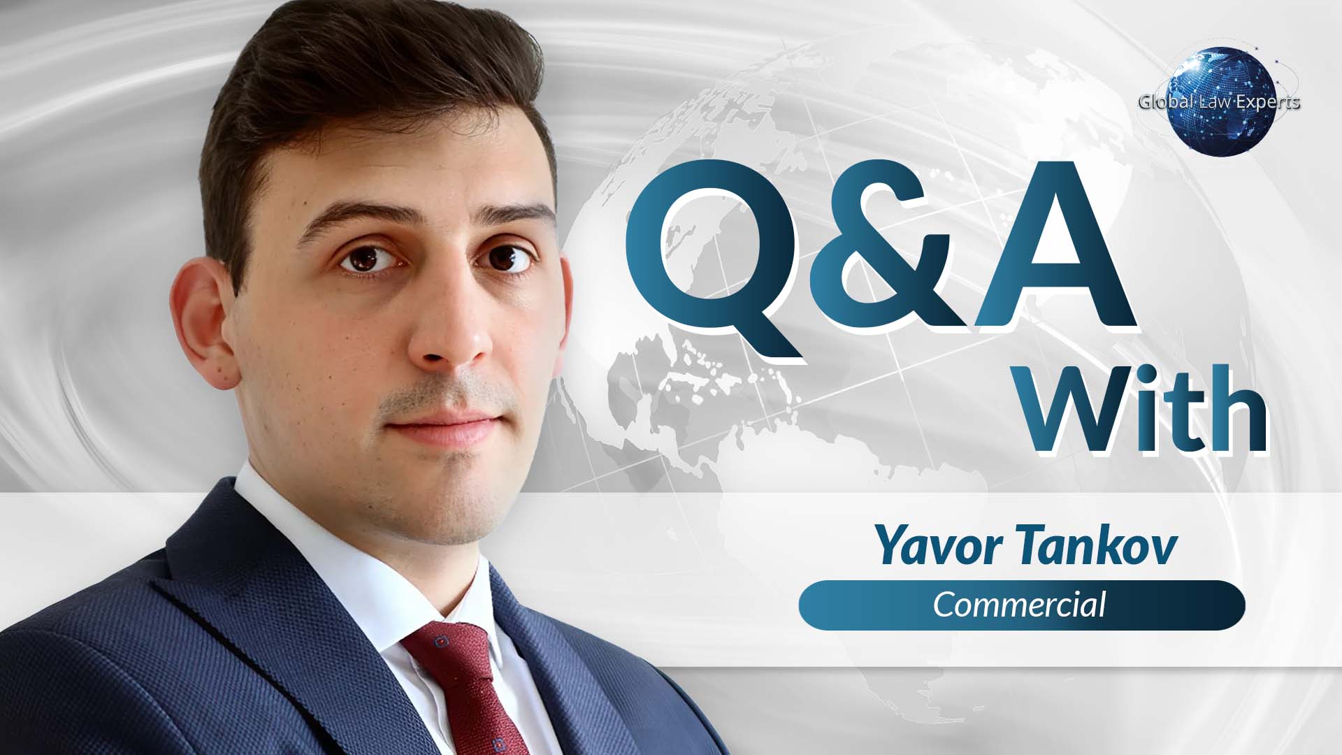Commercial lawyer featured in Q&A interview with a global map background.