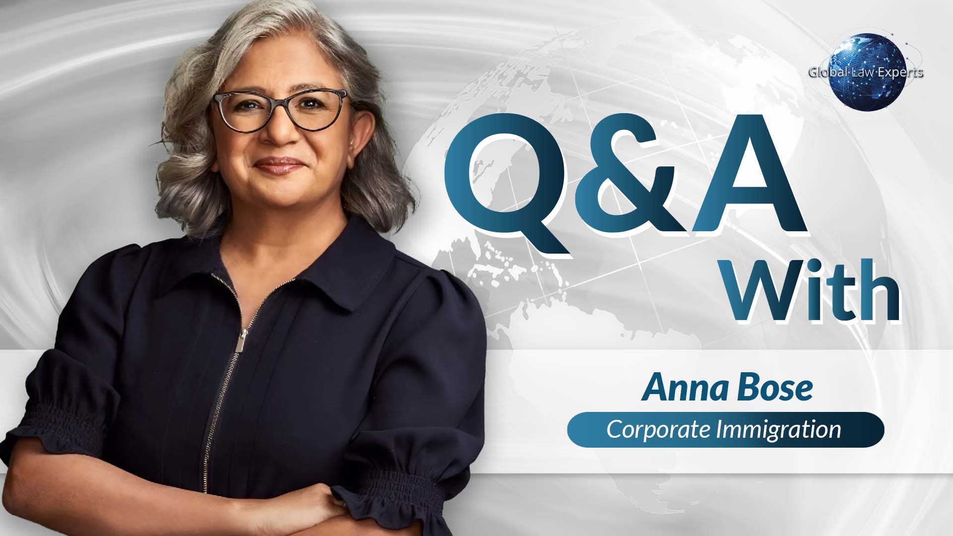 Corporate immigration attorney smiling with arms crossed against a world map background, presented in a Q&A format.