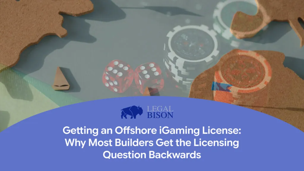 Colorful gaming pieces, including dice and card symbols, on a table with a title about offshore iGaming licensing.