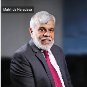 Legal professional in a suit, smiling, in a modern office environment.