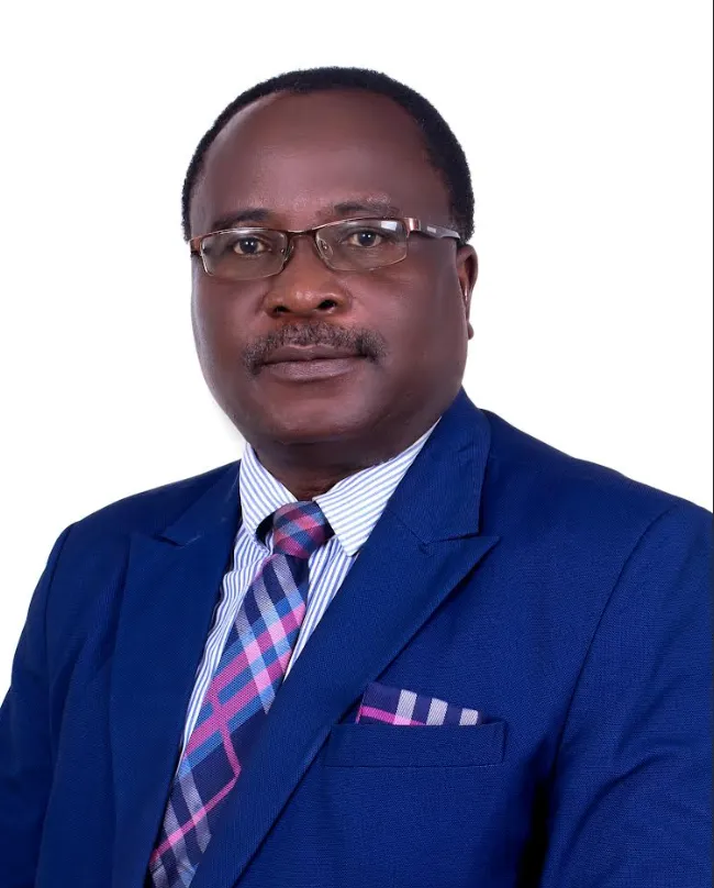 Attorney in a blue suit with glasses, facing the camera against a plain white background.
