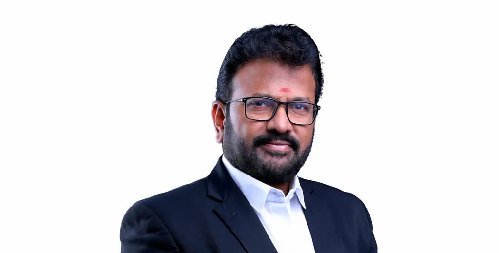 Legal professional wearing glasses and a suit, posing with a neutral expression against a plain background.