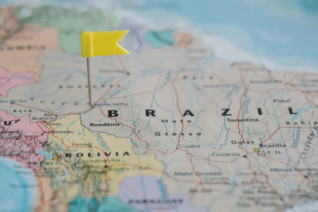 Yellow flag pin marking Brazil on a detailed map of South America.