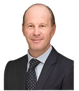 Attorney in business attire smiling and posed in a professional headshot for a legal directory profile.