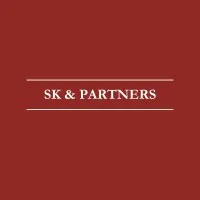 Law firm's logo with the name "SK & PARTNERS" on a solid background.
